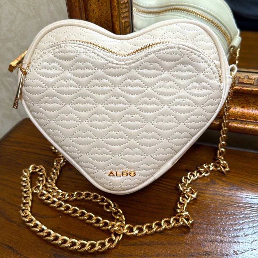 New without tag. ALDO Cream Heart-Shaped Quilted Crossbody Bag. Gold chain.